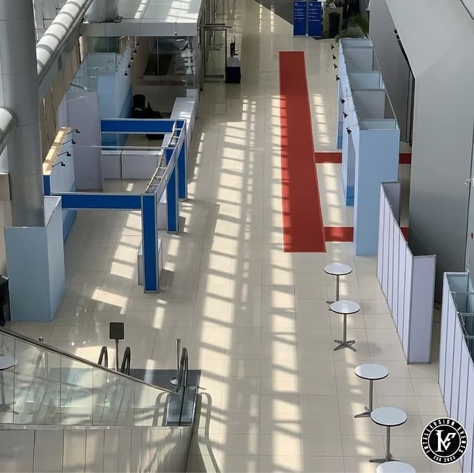Exhibition hall setup with red carpet